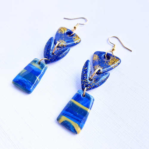 boucles oreilles pate fimo argile polymere resine uv fait main piece unique jadoretesboucles j'adore tes boucles jtb acier inoxydable vendée créatrice française made in France bleu orange citrouille halloween automne paillettes or soleil blanc